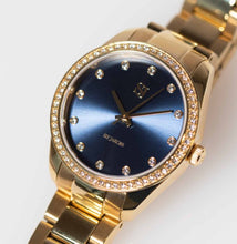 Load image into Gallery viewer, VALERIA - GOLD PLATED STAINLESS STEEL WITH DARK BLUE SUNRAY DIAL AND WHITE ZIRCONIA
